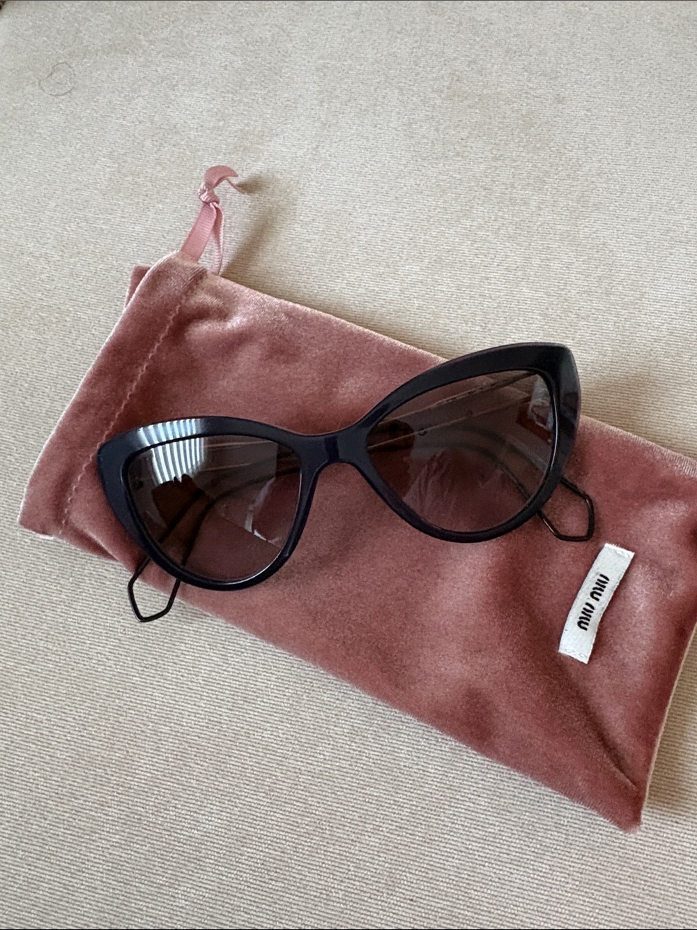 Miu Miu Black Cat-Eye Sunglasses with Dark Lenses